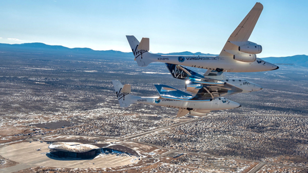 VMS EVE with Spaceshiptwo VSS Unity in captive carry flight above Spaceport America